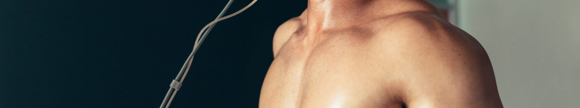 Sports,Man,Running,On,Treadmill,And,Monitoring,His,Fitness,Performance.